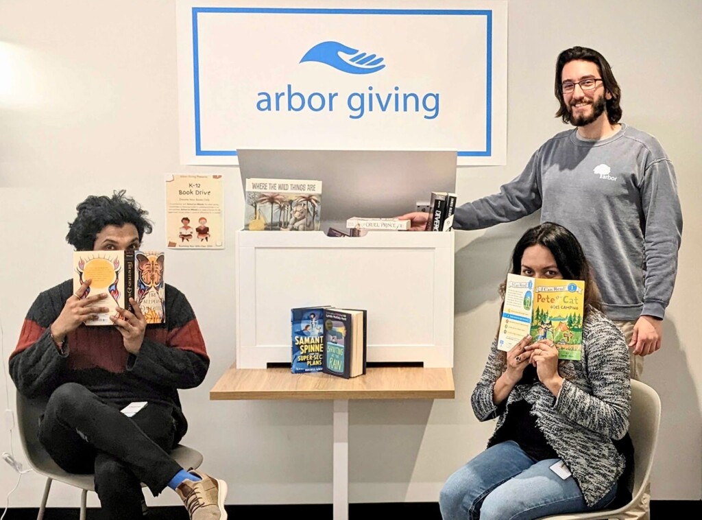 Arbor employees participating in a book collection drive
