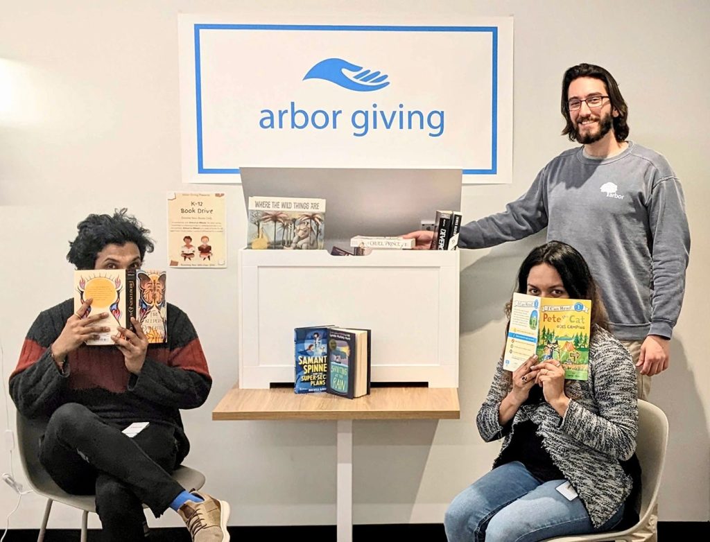 Arbor employees participating in a book collection drive